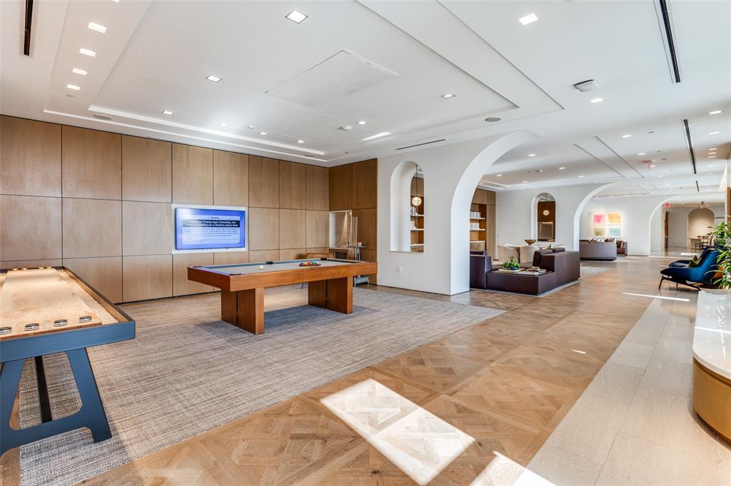3003 Maple Avenue, Unit 2220 Dallas, TX 75201 - Photo 28 of 40 a living room with furniture and a table