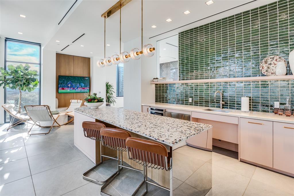 3003 Maple Avenue, Unit 2220 Dallas, TX 75201 - Photo 32 of 40 a living room with granite countertop furniture and fireplace