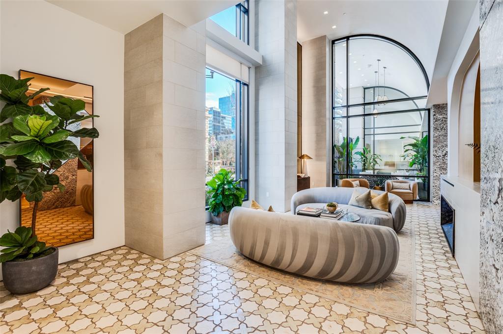 3003 Maple Avenue, Unit 2220 Dallas, TX 75201 - Photo 34 of 40 a bedroom with furniture and a potted plant