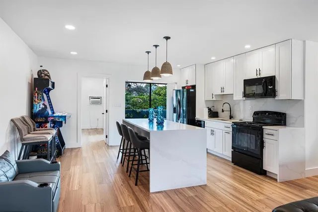 a large bedroom with a bed and a desk