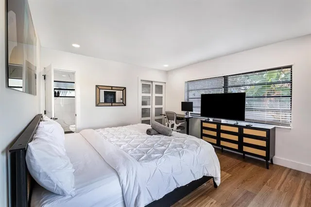 a view of a house with swimming pool and furniture