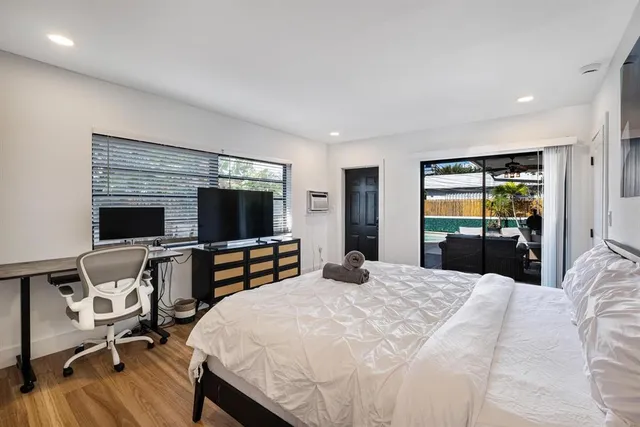 a house view with a sitting space and garden