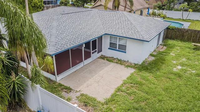 a aerial view of a house with roof deck front of house