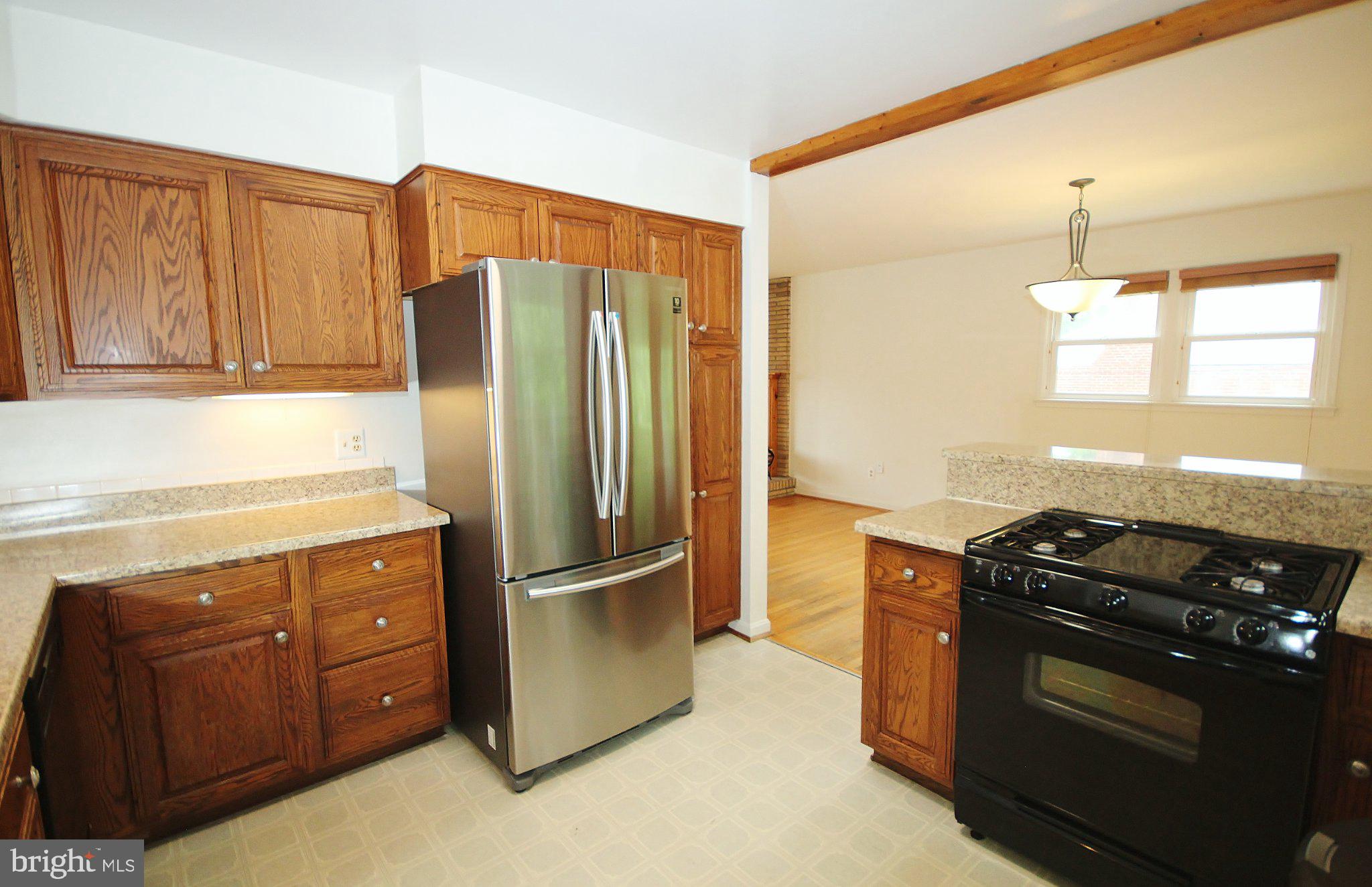 5504 Inverchapel Road Springfield, VA 22151 - Photo 8 of 51 Modern kitchen with warm wood accents.