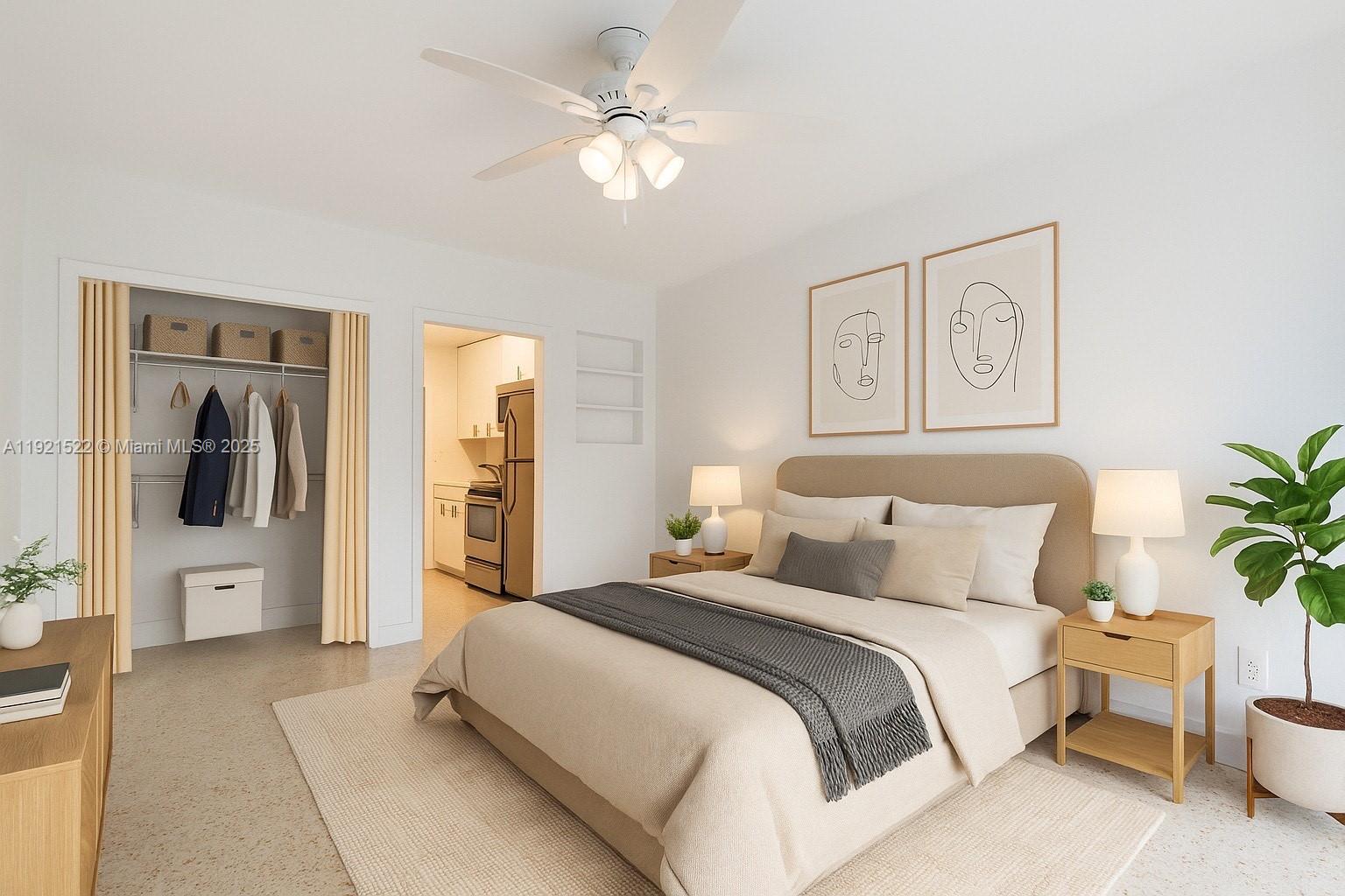 1450 Southwest 6th Street, Unit 1 Miami, FL 33135 - Photo 1 of 7 a bedroom with a large bed and a chandelier