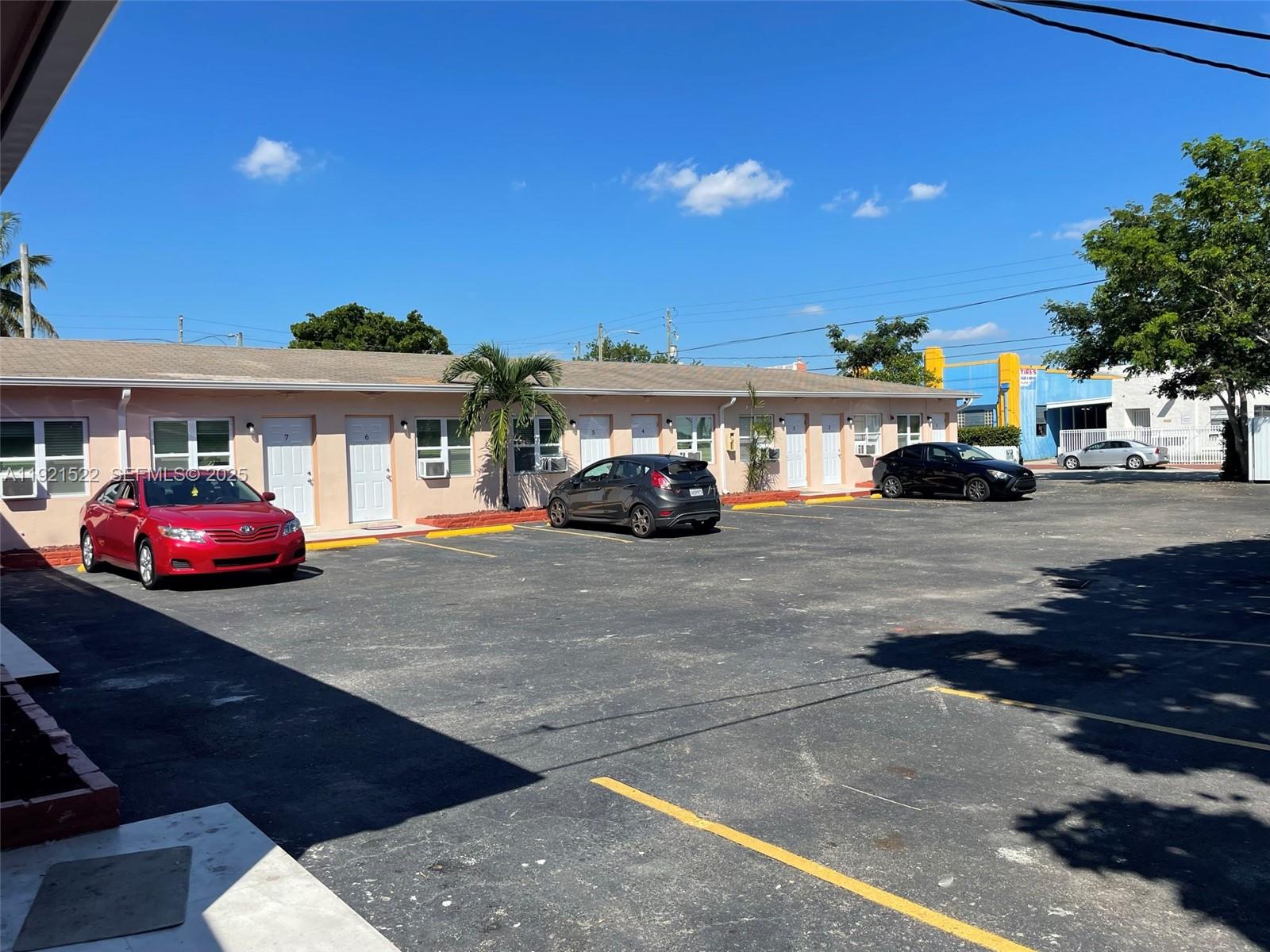 1450 Southwest 6th Street, Unit 1 Miami, FL 33135 - Photo 6 of 7 a car parked in front of a building