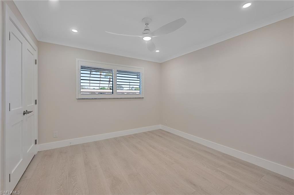 9 High Point Circle North, Unit 108 Naples, FL 34103 - Photo 11 of 17 Primary Bedroom