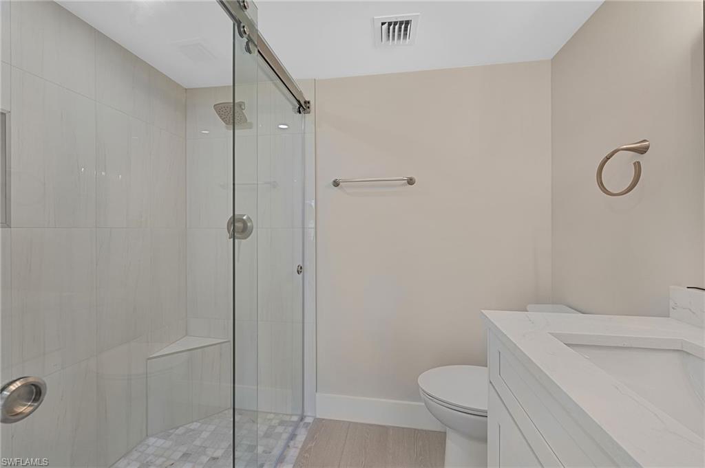 9 High Point Circle North, Unit 108 Naples, FL 34103 - Photo 12 of 17 Primary Bathroom
