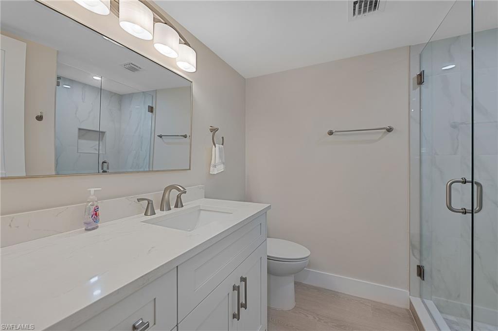 9 High Point Circle North, Unit 108 Naples, FL 34103 - Photo 14 of 17 Guest Bathroom