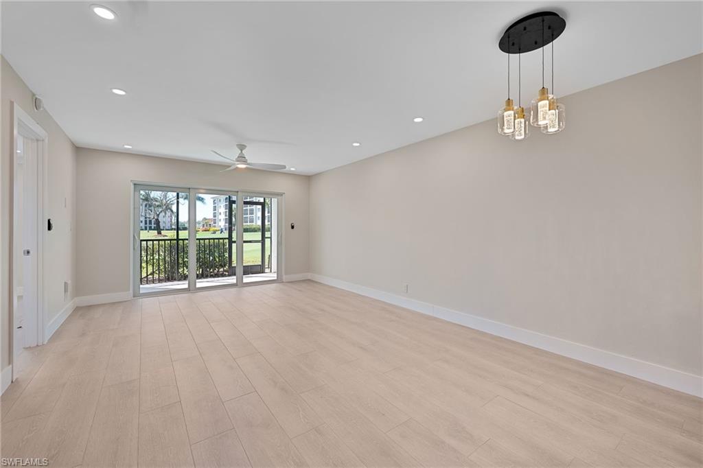 9 High Point Circle North, Unit 108 Naples, FL 34103 - Photo 6 of 17 Living Area to Lanai