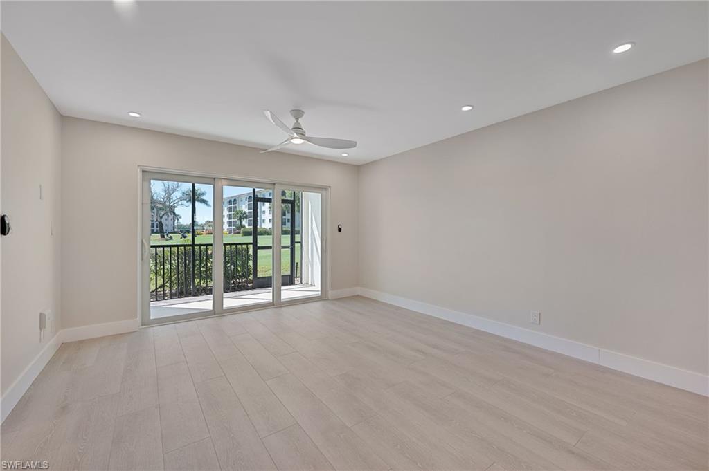 9 High Point Circle North, Unit 108 Naples, FL 34103 - Photo 7 of 17 Living Room to Lanai