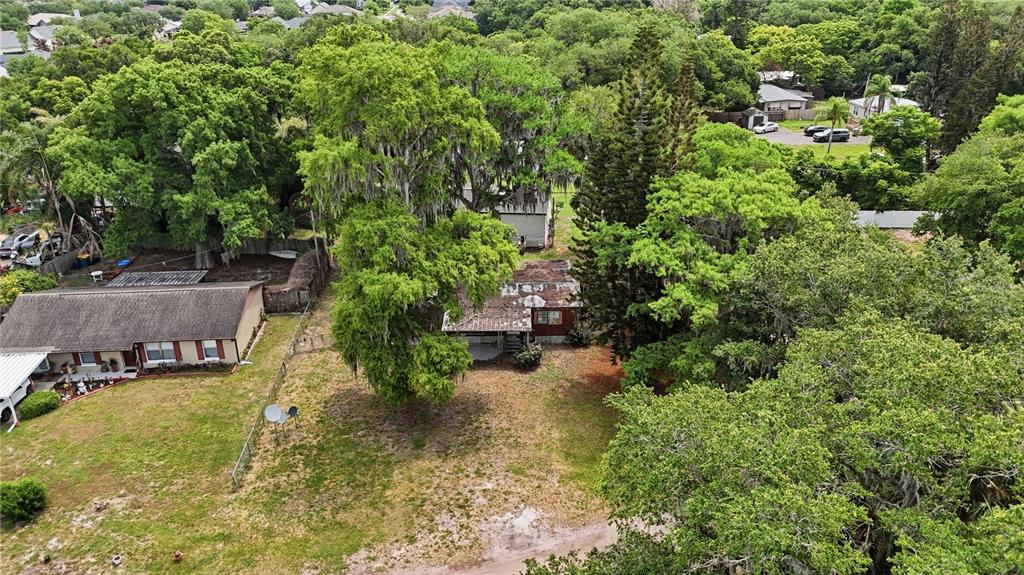 4791 Sunset Road St. Cloud, FL 34771 - Photo 1 of 7 an aerial view of a house with a yard