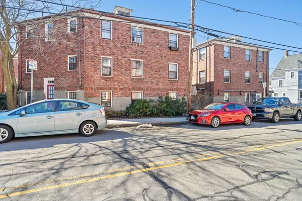 a car parked in front of a building