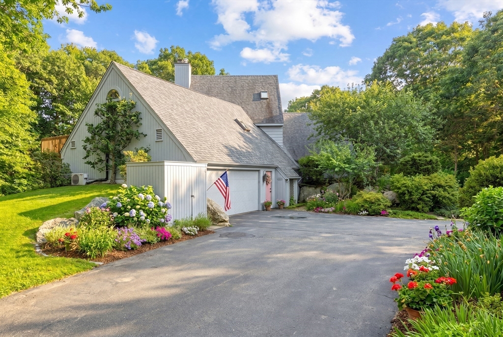 94 Howland Road Westport, MA 02790 - Photo 4 of 33 a front view of a house with a yard and garage