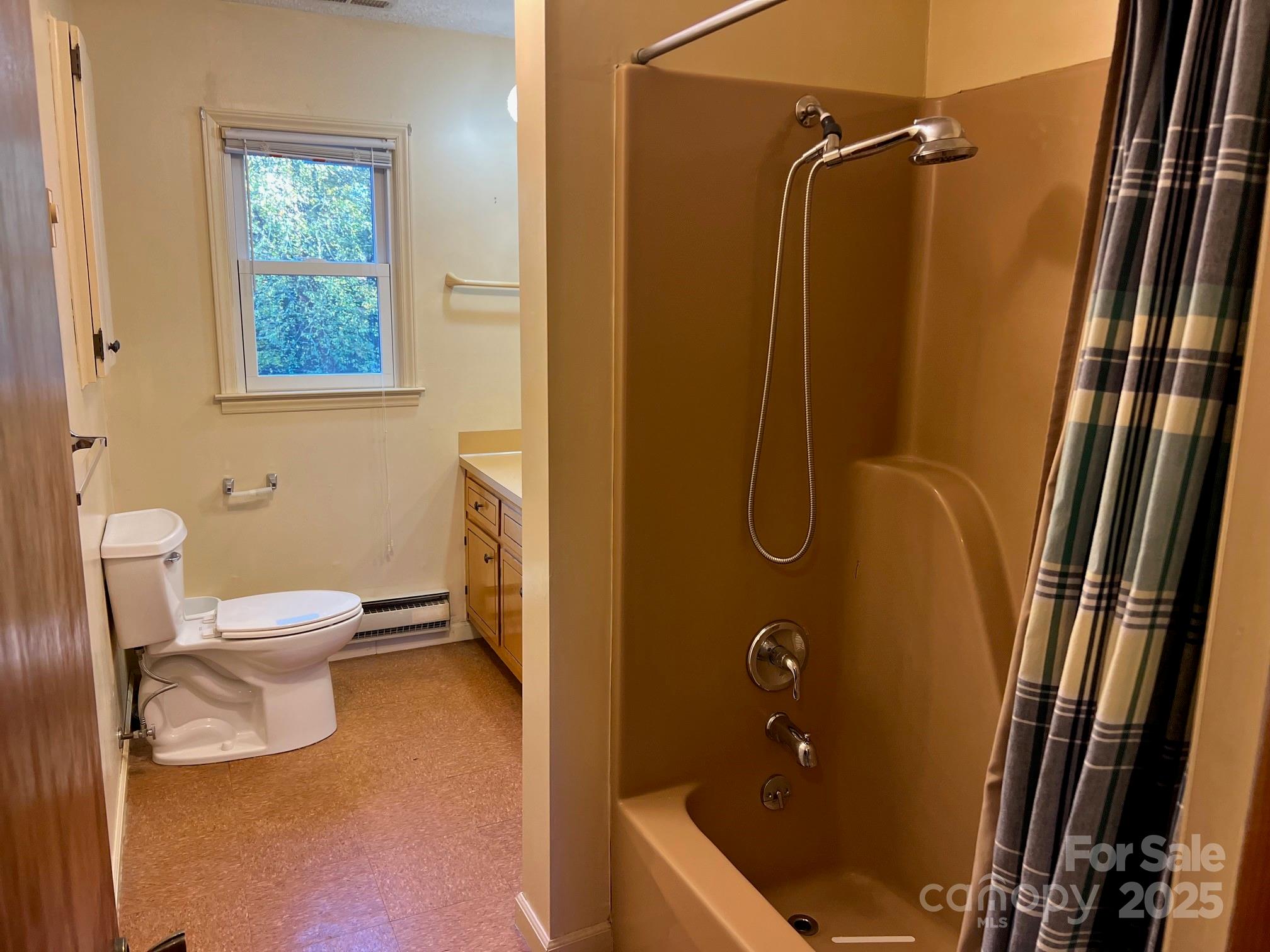 2819 Playmore Beach Road Morganton, NC 28655 - Photo 18 of 30 a bathroom with a granite countertop shower sink vanity and toilet