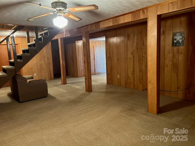 a white toilet sitting next to a shower curtain