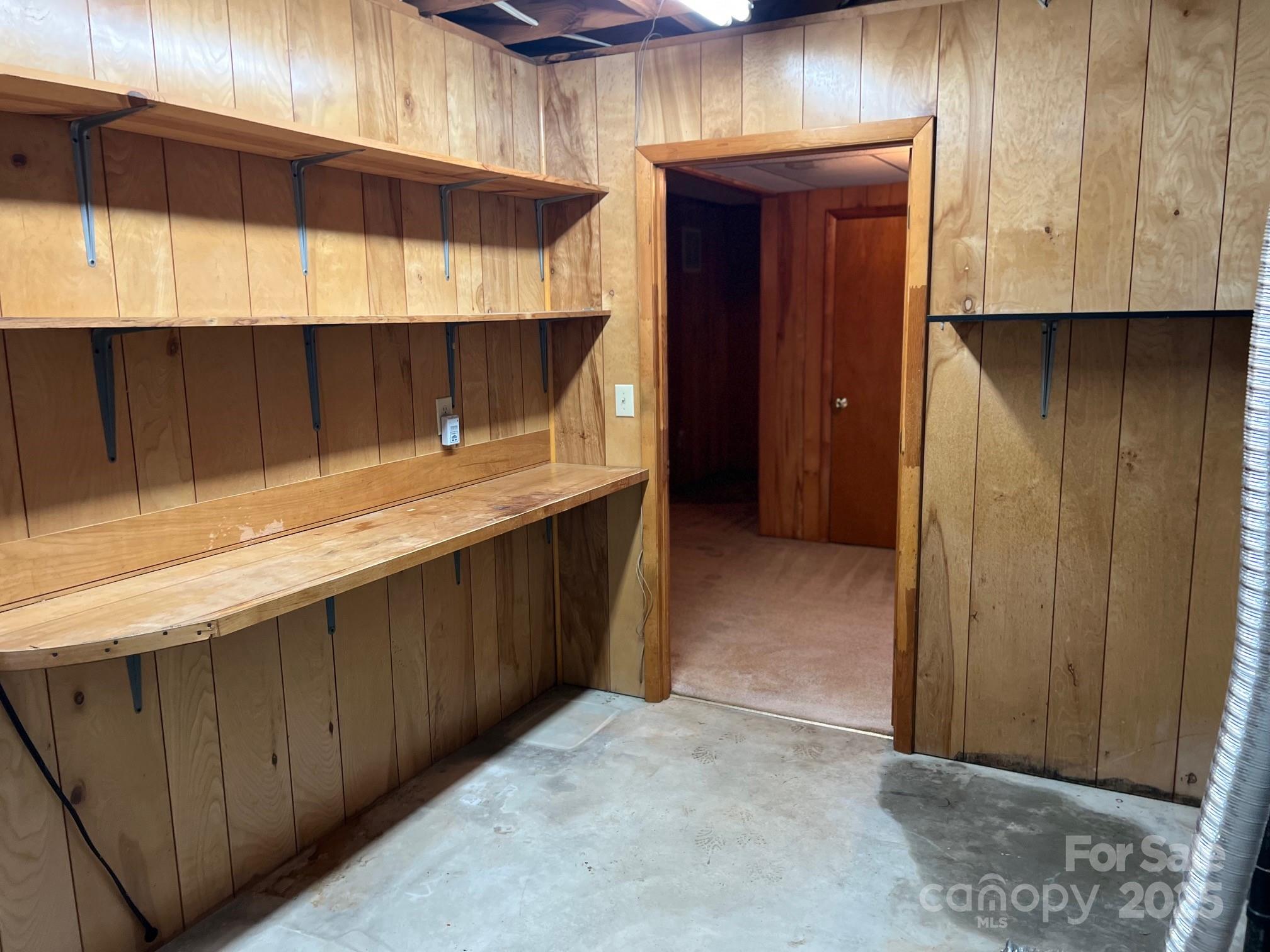 2819 Playmore Beach Road Morganton, NC 28655 - Photo 26 of 30 a kitchen with stainless steel appliances a cabinets and wooden floor