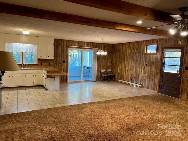a kitchen with appliances a refrigerator and cabinets