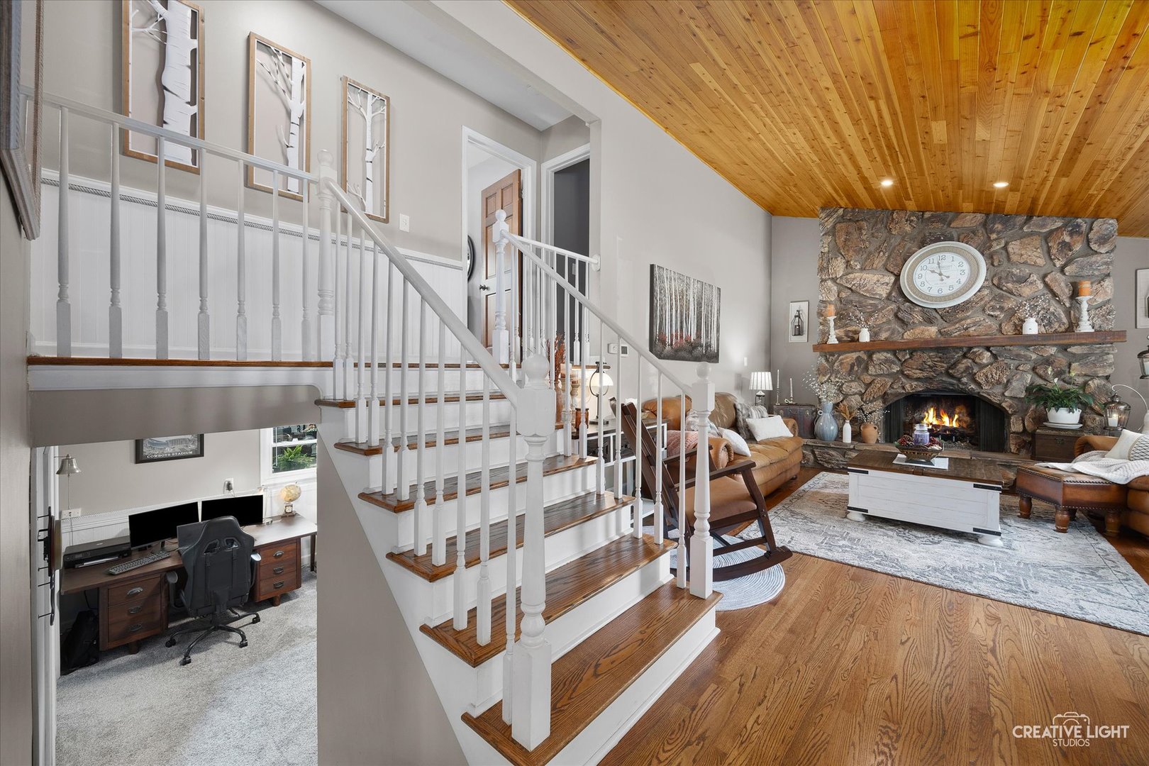 124 Fairview Drive St. Charles, IL 60174 - Photo 11 of 37 a view of a livingroom with furniture a fireplace a sink and dishwasher