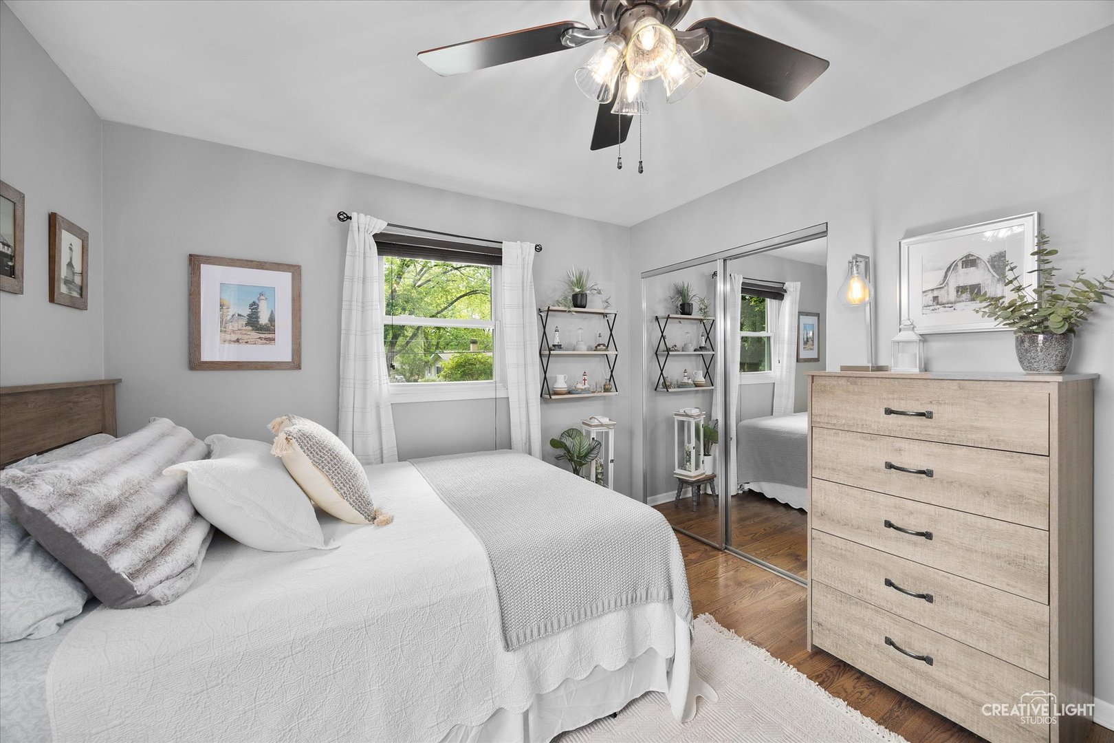 124 Fairview Drive St. Charles, IL 60174 - Photo 20 of 37 a bedroom with a bed chandelier and a window