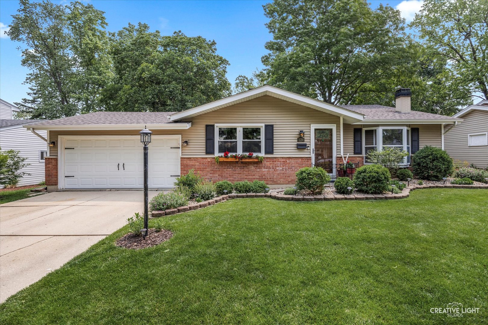 124 Fairview Drive St. Charles, IL 60174 - Photo 2 of 37 a front view of house with yard and green space