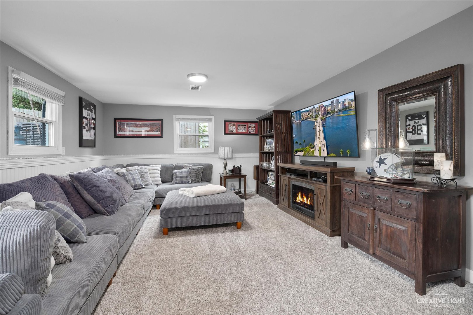 124 Fairview Drive St. Charles, IL 60174 - Photo 22 of 37 a living room with furniture and a flat screen tv