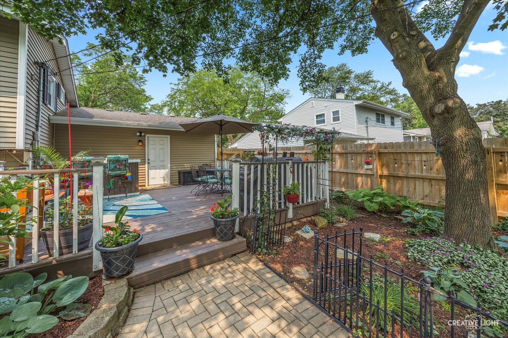 124 Fairview Drive St. Charles, IL 60174 - Photo 28 of 37 a view of a chair and table in the backyard