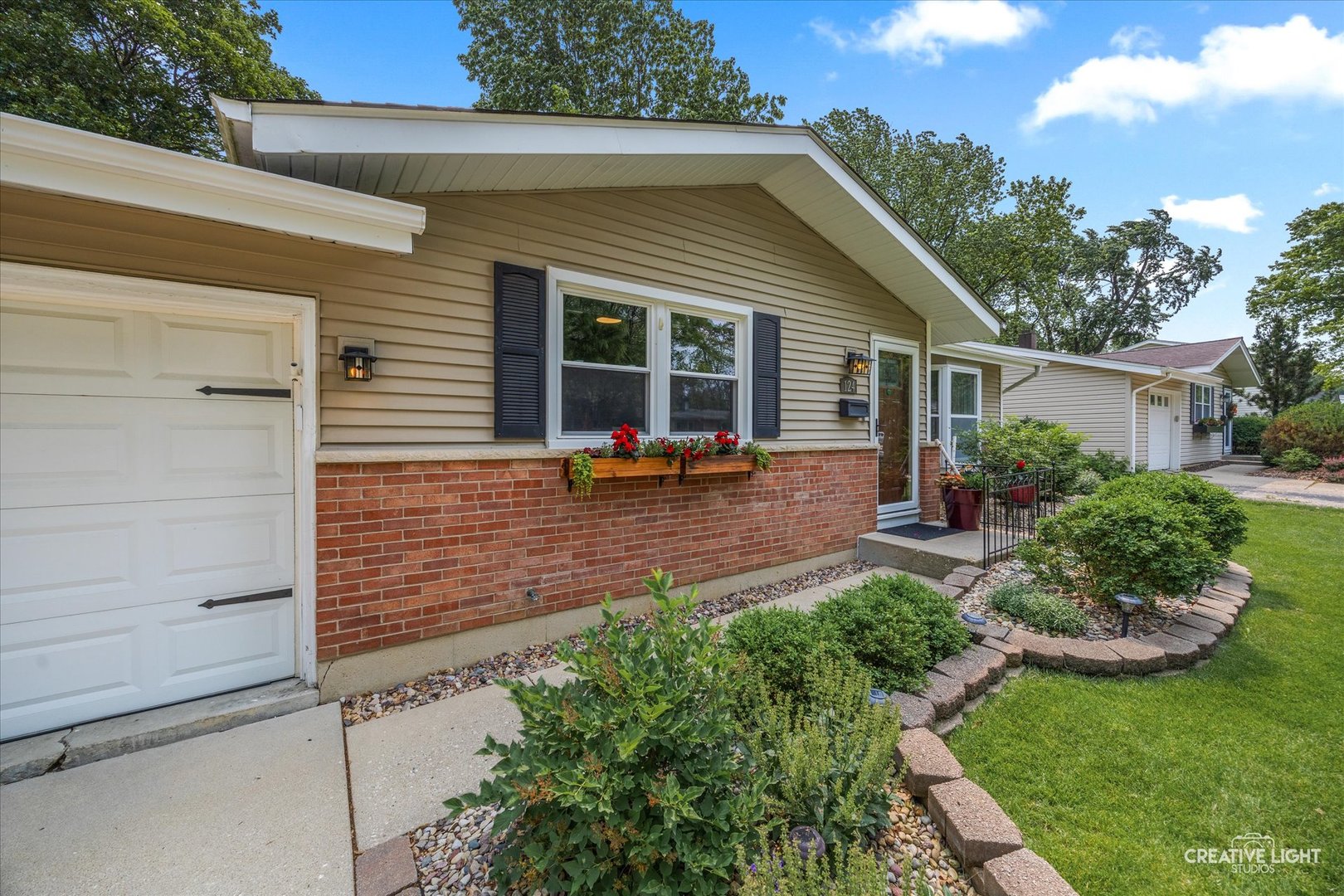 124 Fairview Drive St. Charles, IL 60174 - Photo 3 of 37 a front view of a house with garden