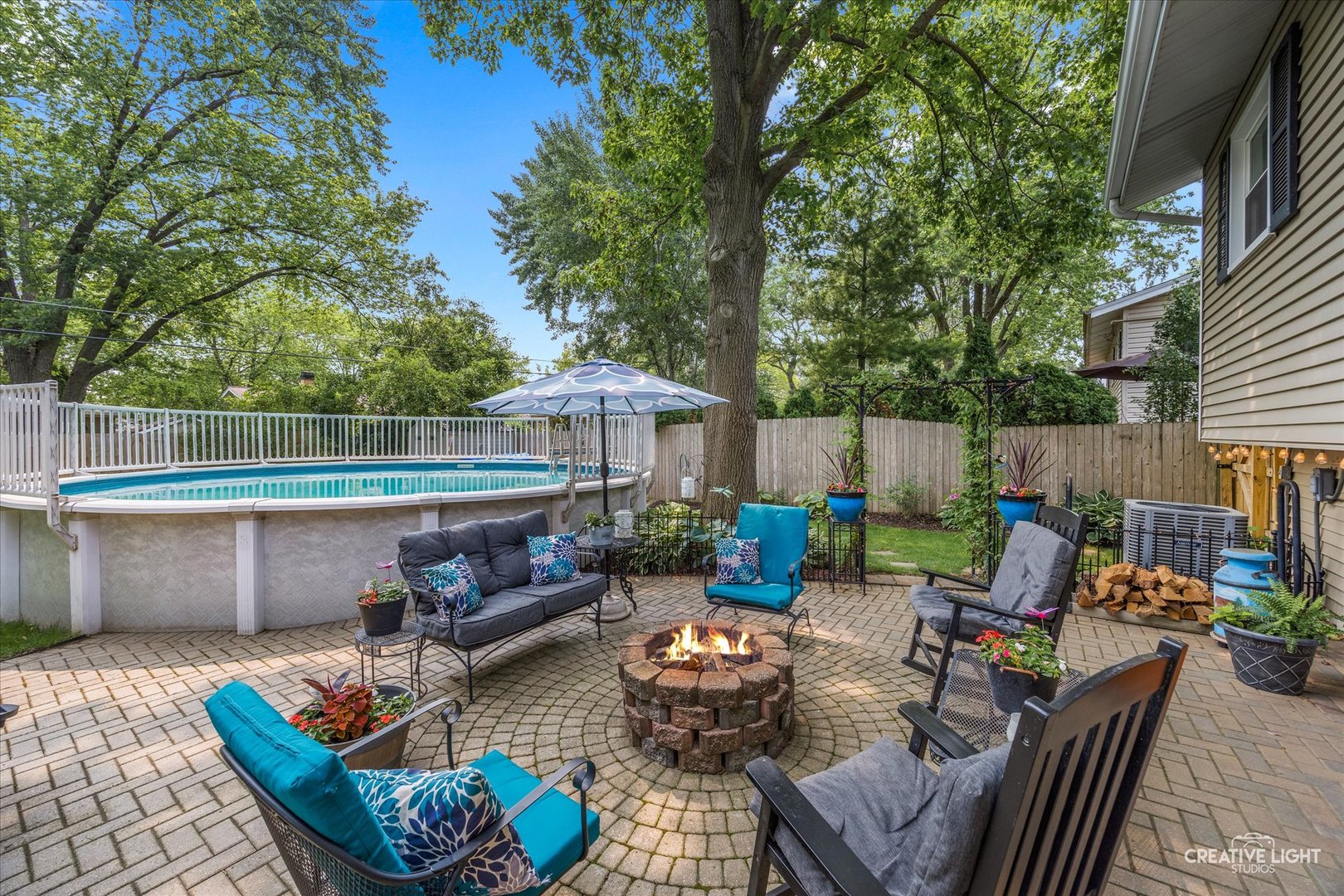 124 Fairview Drive St. Charles, IL 60174 - Photo 33 of 37 a view of a patio with couches chairs and a fire pit