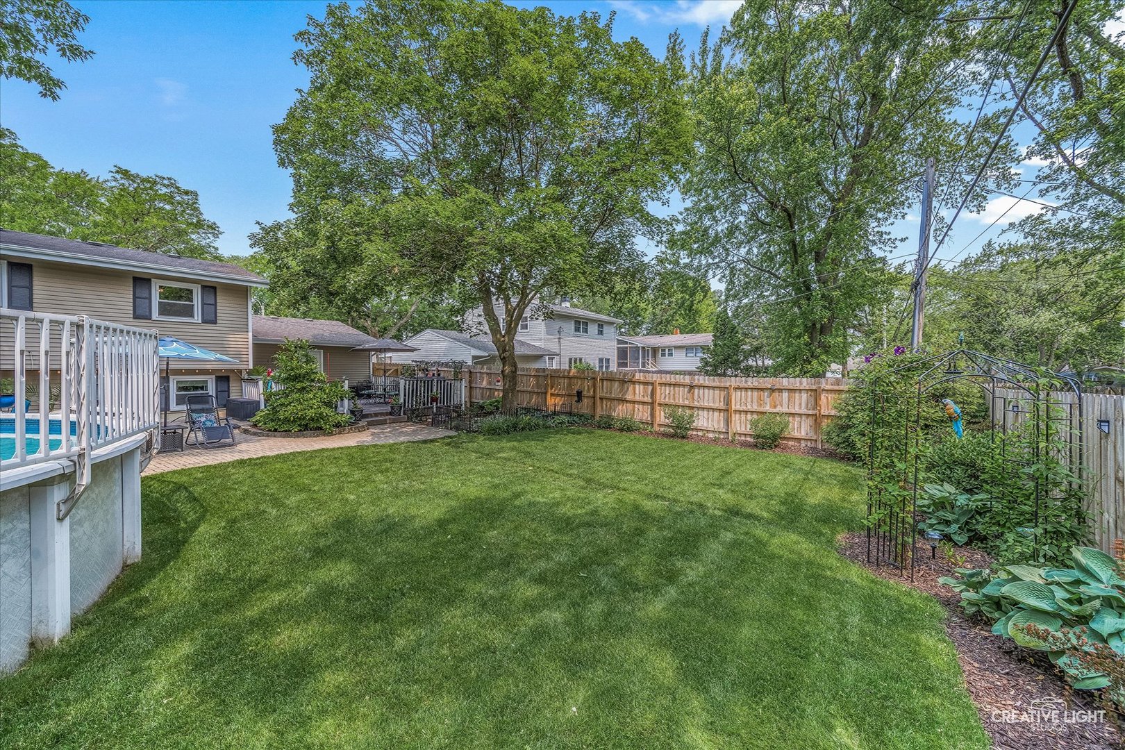 124 Fairview Drive St. Charles, IL 60174 - Photo 37 of 37 a backyard of a house with barbeque oven and trees
