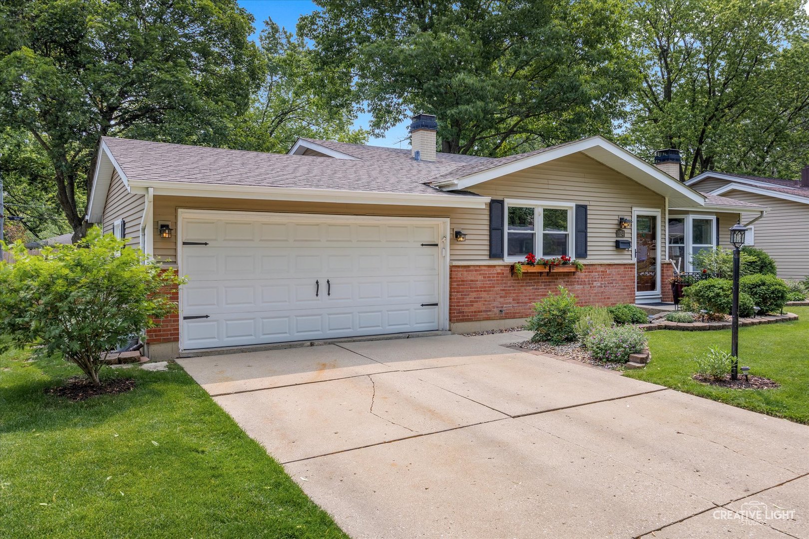 124 Fairview Drive St. Charles, IL 60174 - Photo 4 of 37 a front view of house with yard and trees around