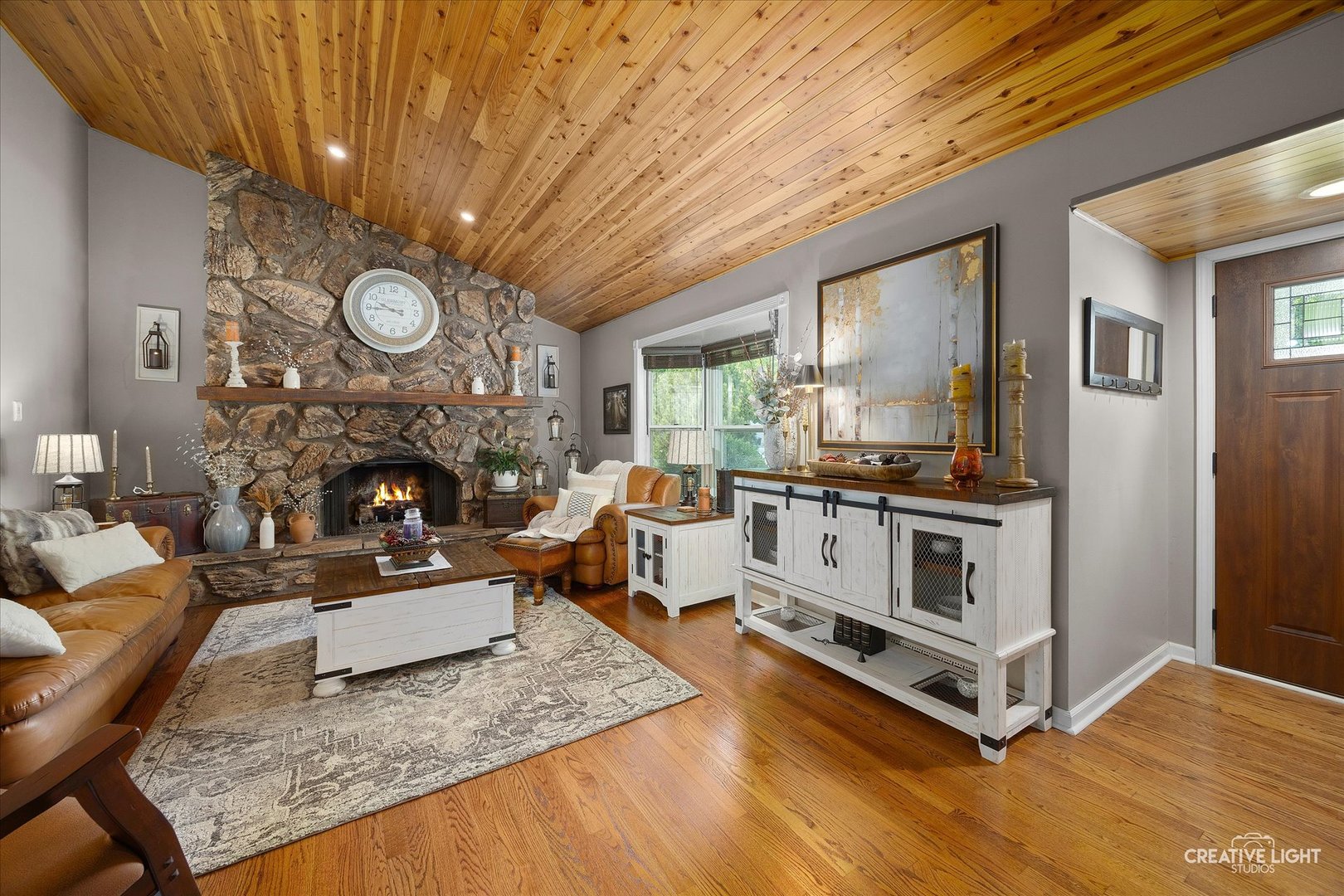124 Fairview Drive St. Charles, IL 60174 - Photo 5 of 37 a living room with furniture and a fireplace