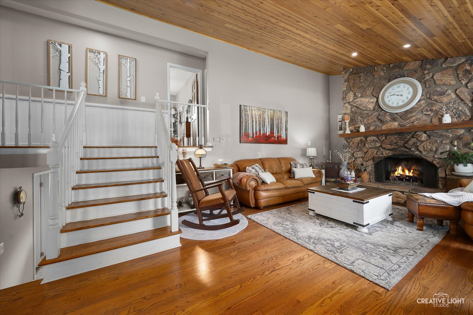 124 Fairview Drive St. Charles, IL 60174 - Photo 6 of 37 a living room with furniture and a fireplace