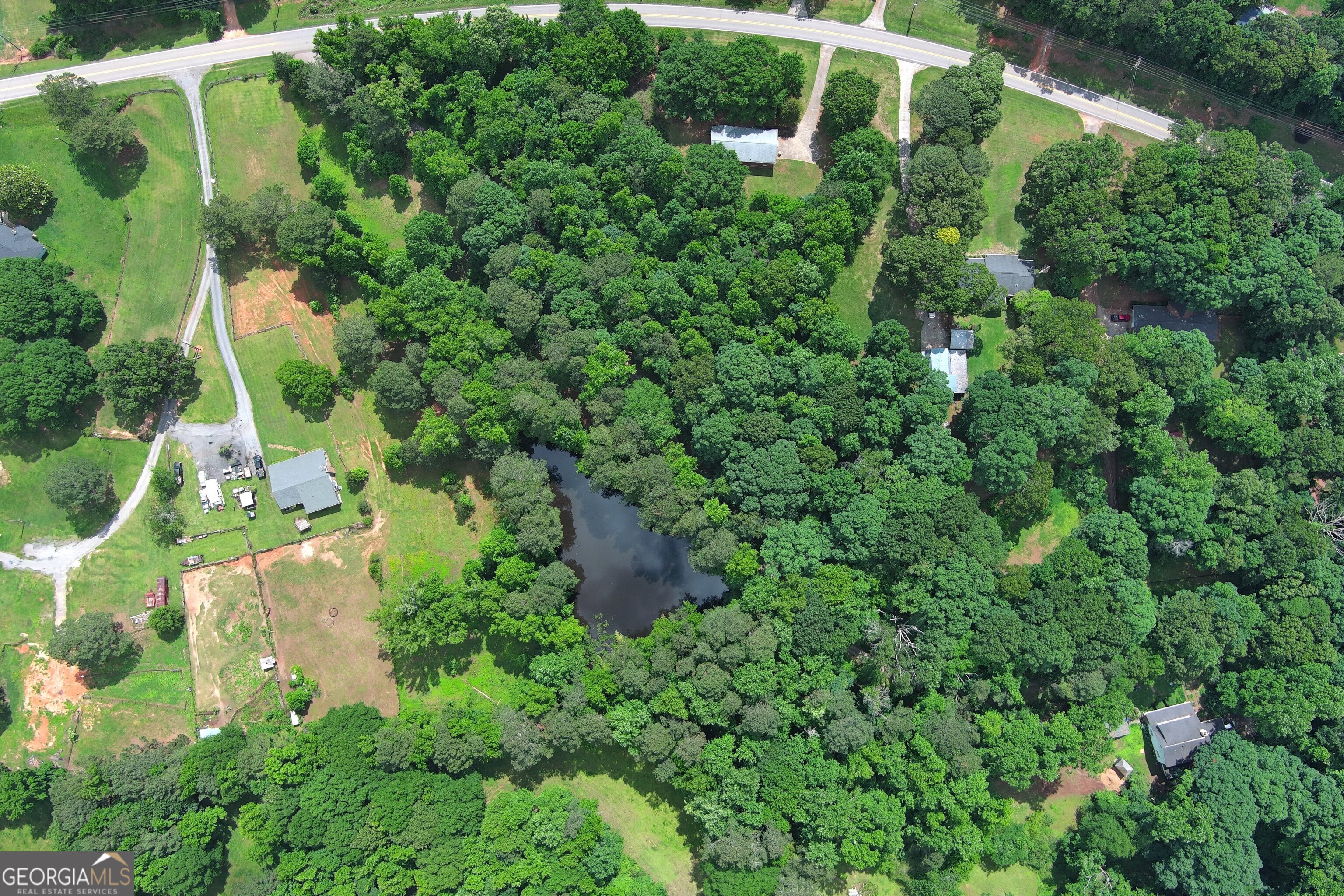 491 Thurman Road, Unit TRACT C Stockbridge, GA 30281 - Photo 13 of 18 an aerial view of residential house with outdoor space and trees all around