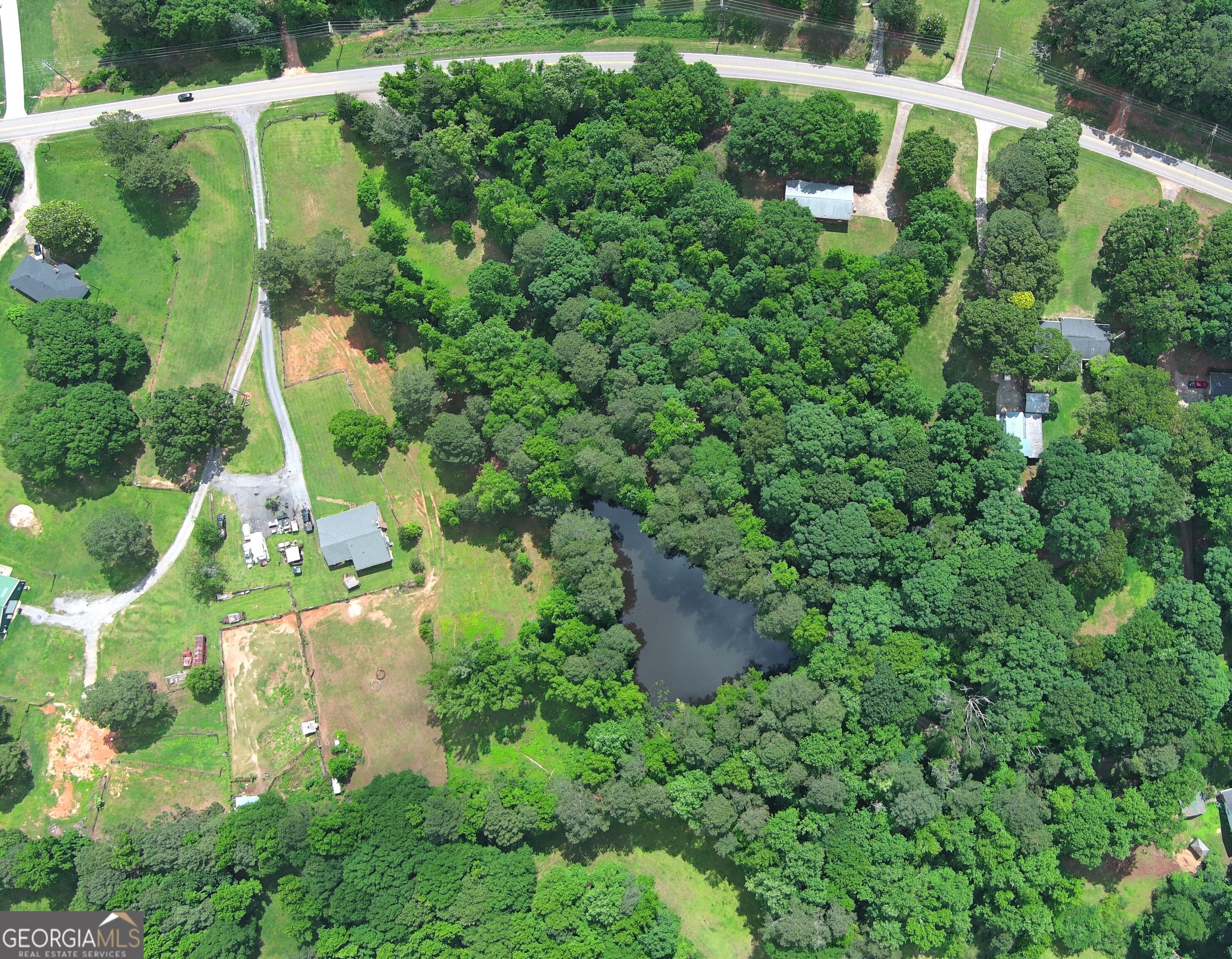 491 Thurman Road, Unit TRACT C Stockbridge, GA 30281 - Photo 15 of 18 an aerial view of a house with a yard