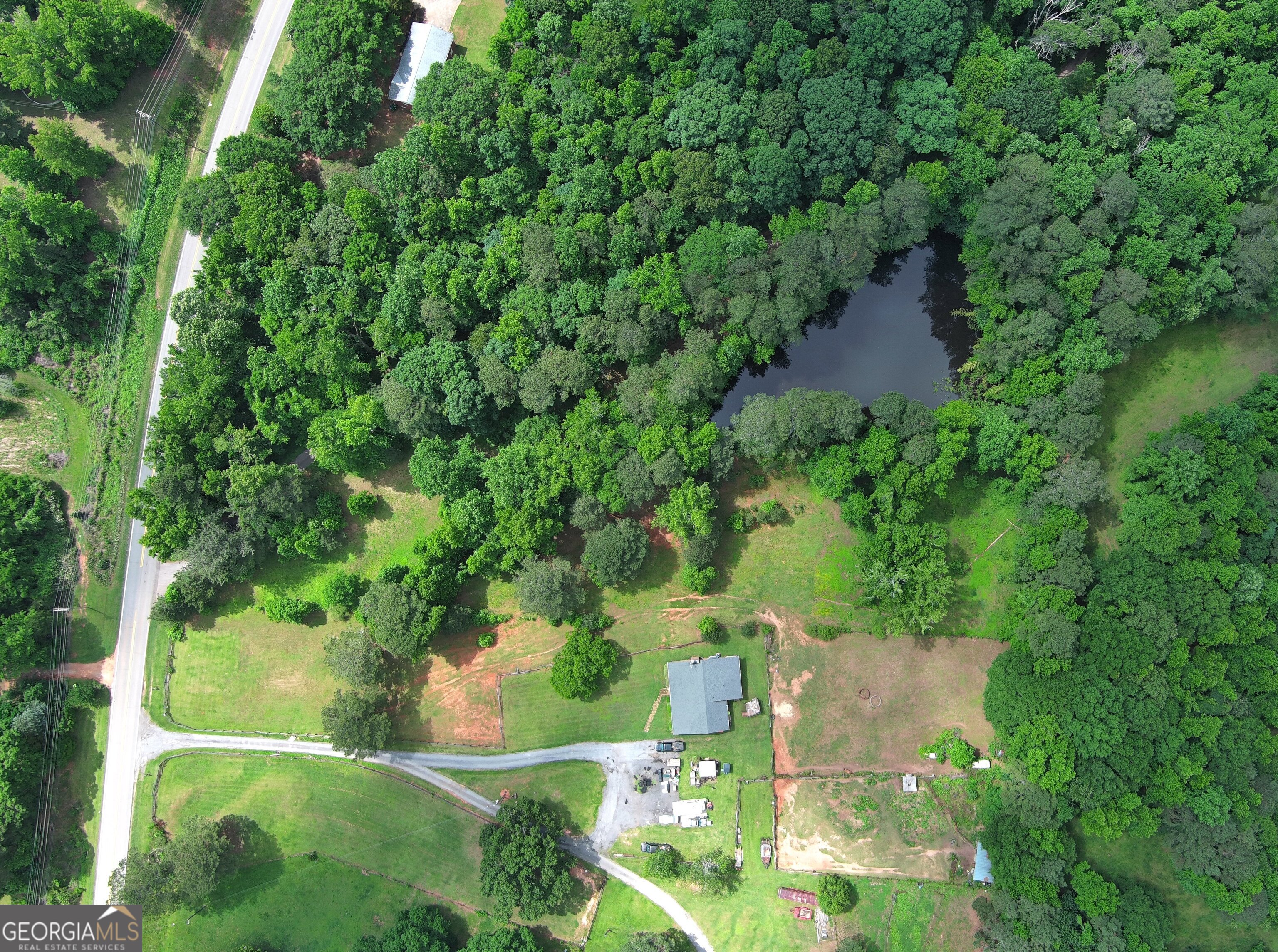 491 Thurman Road, Unit TRACT C Stockbridge, GA 30281 - Photo 7 of 18 an aerial view of residential houses with outdoor space and trees all around