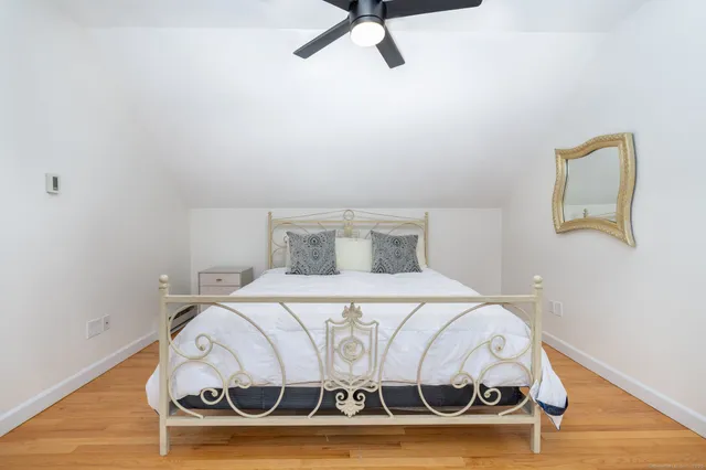 a bedroom with a bed and a table