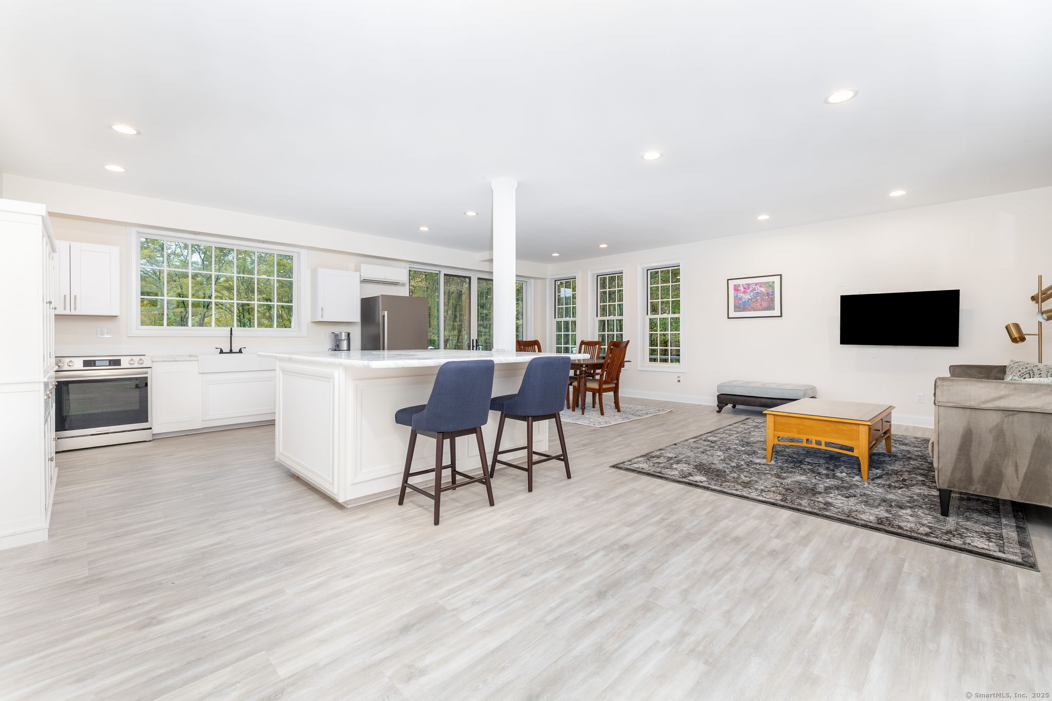 235 White Deer Rock Road, Unit GUEST Woodbury, CT 06798 - Photo 2 of 21 a living room with furniture and a flat screen tv