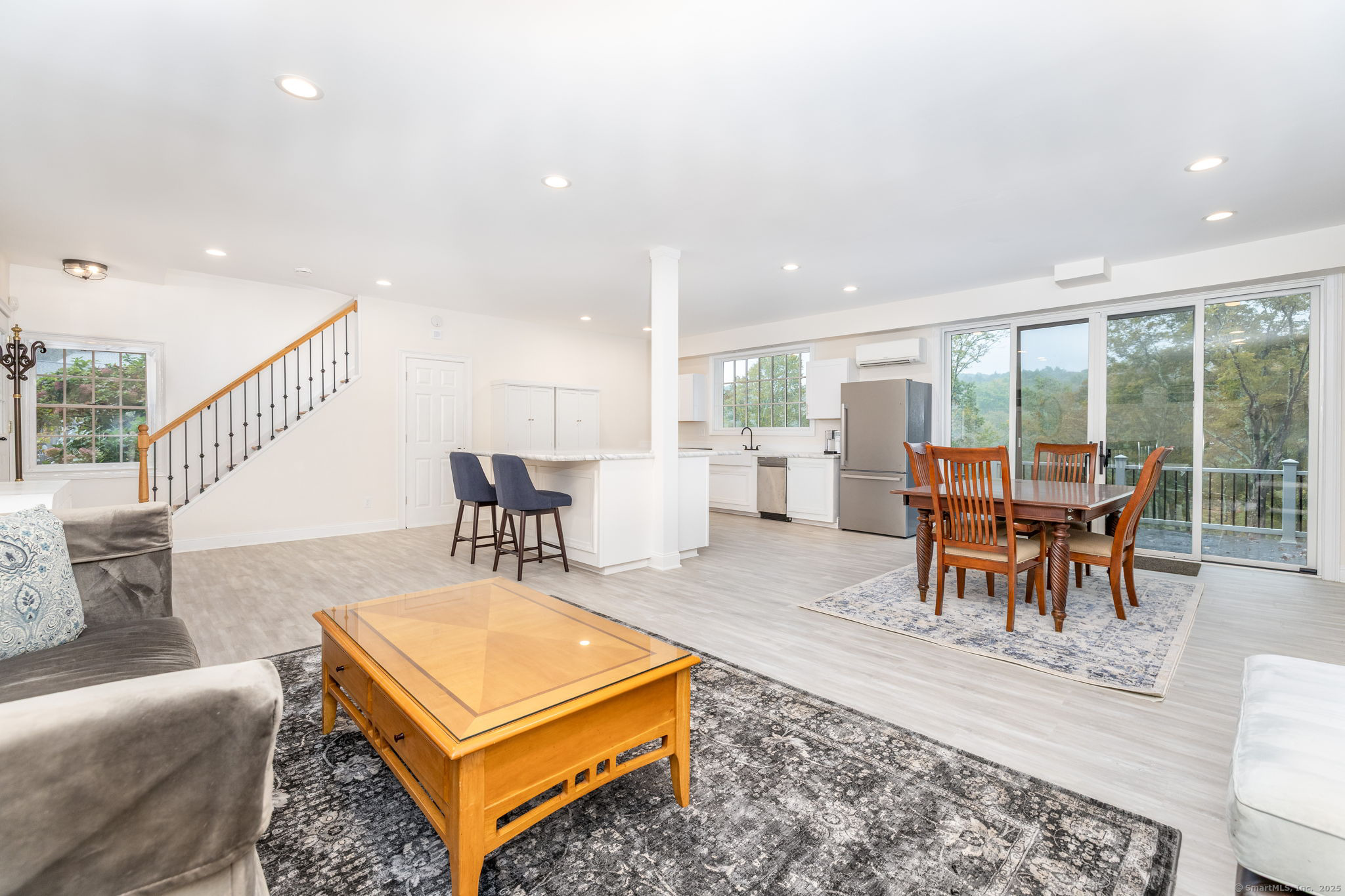 235 White Deer Rock Road, Unit GUEST Woodbury, CT 06798 - Photo 4 of 21 a living room with furniture a rug and a large window