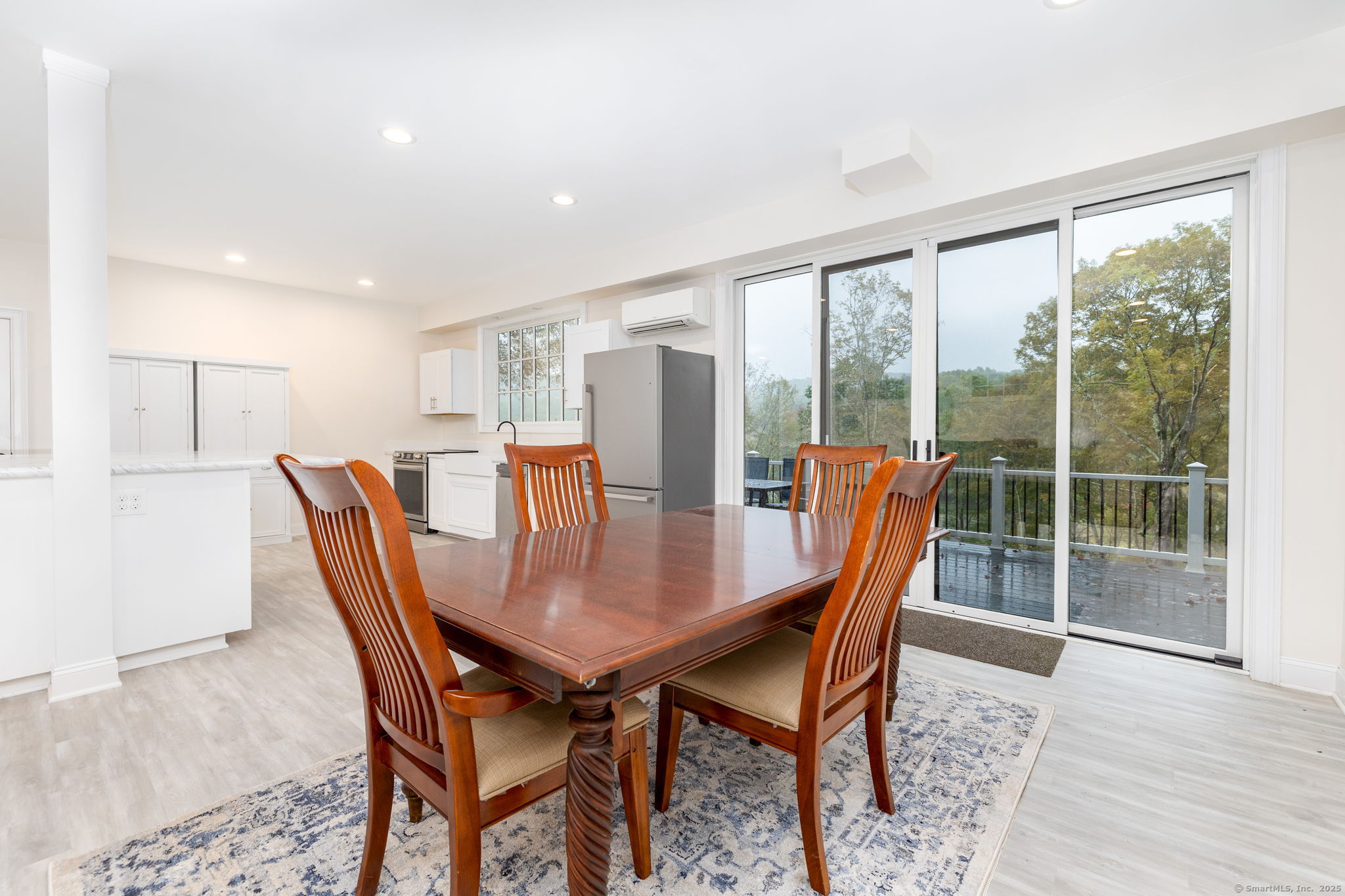 235 White Deer Rock Road, Unit GUEST Woodbury, CT 06798 - Photo 5 of 21 a view of a dining room with furniture window and wooden floor