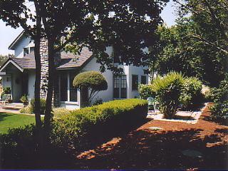2097 Fulton Road Santa Rosa, CA 95403 - Photo 1 of 5 a front view of a house with a yard and outdoor seating