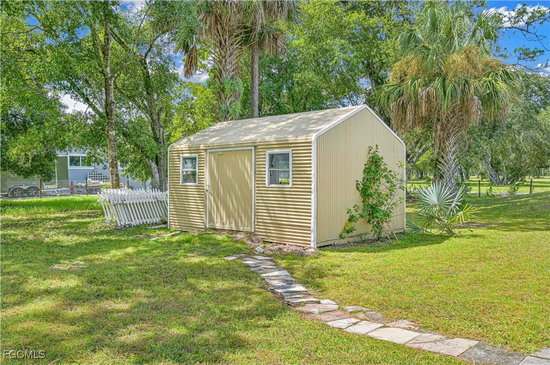 6840 Cadet Avenue Fort Myers, FL 33905 - Photo 15 of 37 a view of a house with a yard