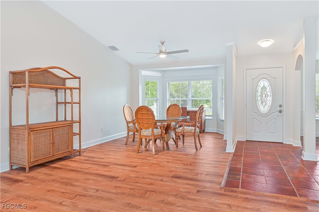 6840 Cadet Avenue Fort Myers, FL 33905 - Photo 20 of 37 a view of a dining room with furniture and wooden floor