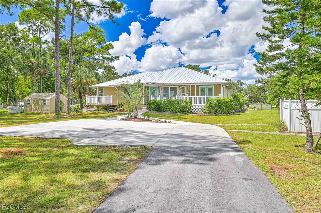 6840 Cadet Avenue Fort Myers, FL 33905 - Photo 2 of 37 a front view of house with yard and green space