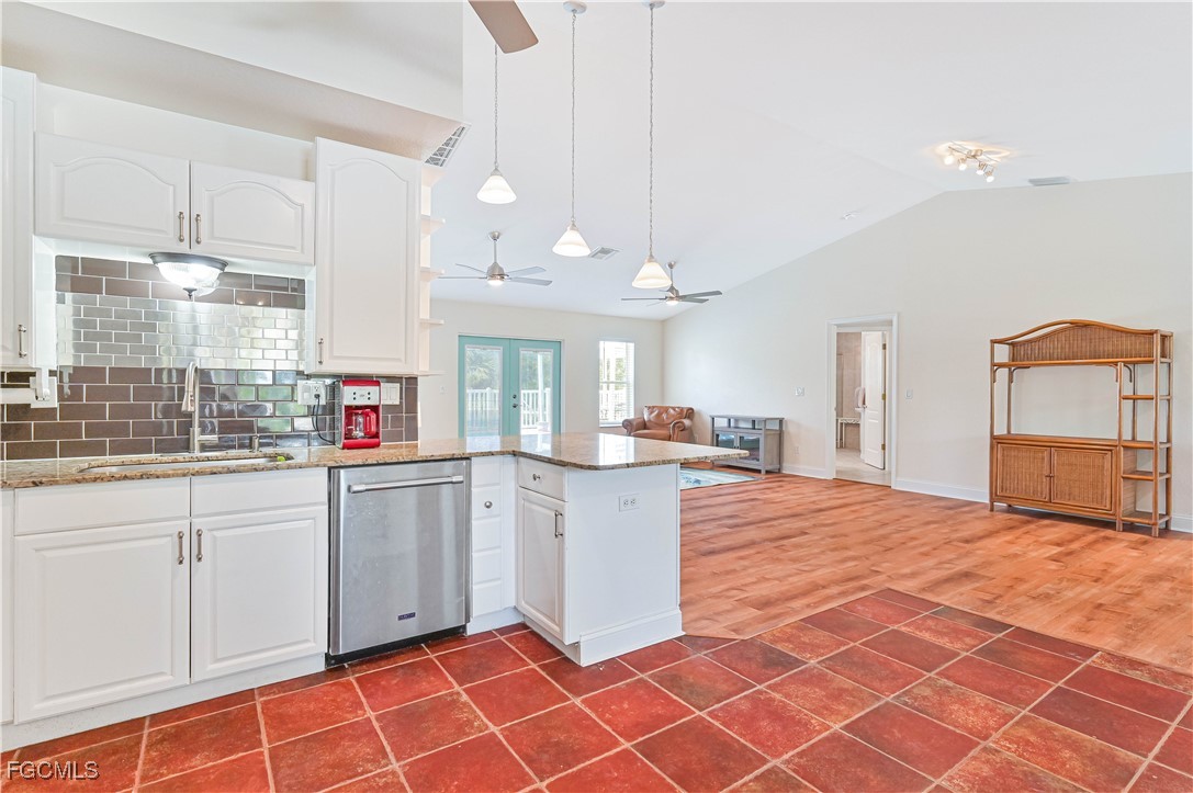 6840 Cadet Avenue Fort Myers, FL 33905 - Photo 24 of 37 a kitchen with stainless steel appliances granite countertop a stove a sink and a refrigerator