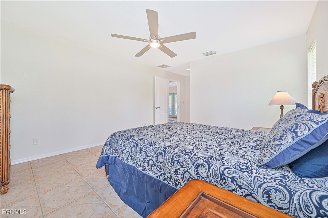 6840 Cadet Avenue Fort Myers, FL 33905 - Photo 27 of 37 a bedroom with a bed and a dresser
