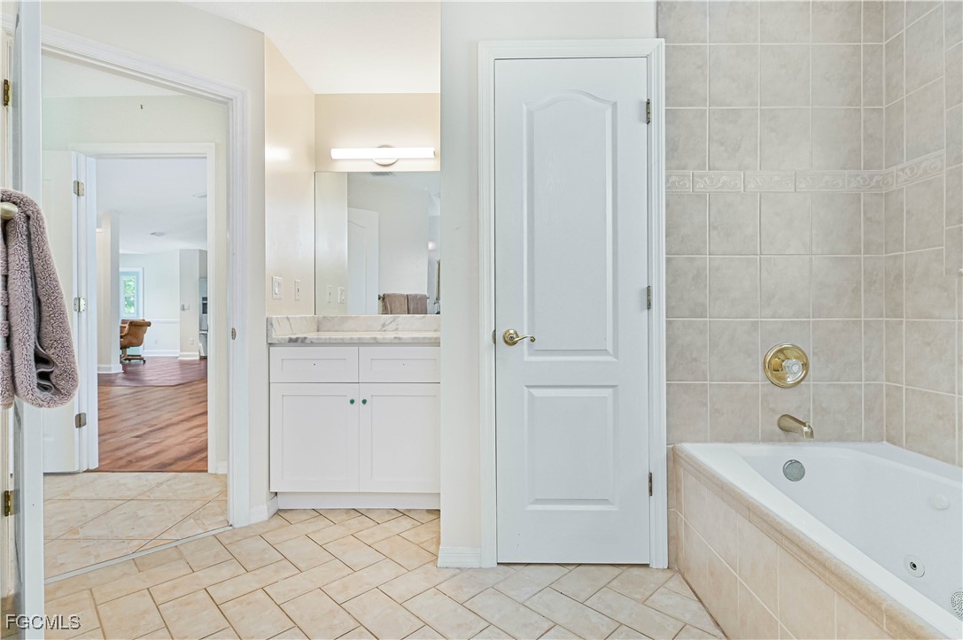 6840 Cadet Avenue Fort Myers, FL 33905 - Photo 29 of 37 a bathroom with a tub shower and sink