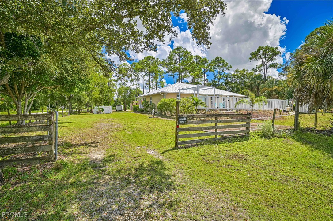 6840 Cadet Avenue Fort Myers, FL 33905 - Photo 8 of 37 a view of a bench with wooden fence