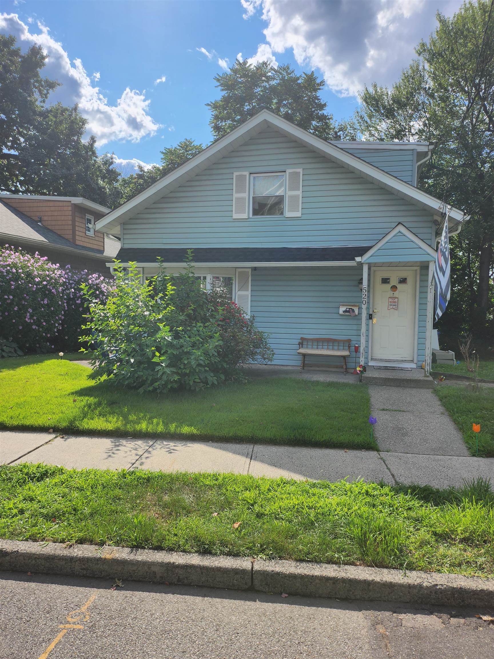 520 Stuyvesant Avenue Rutherford, NJ 07070 - Photo 1 of 9 a front view of a house with a yard