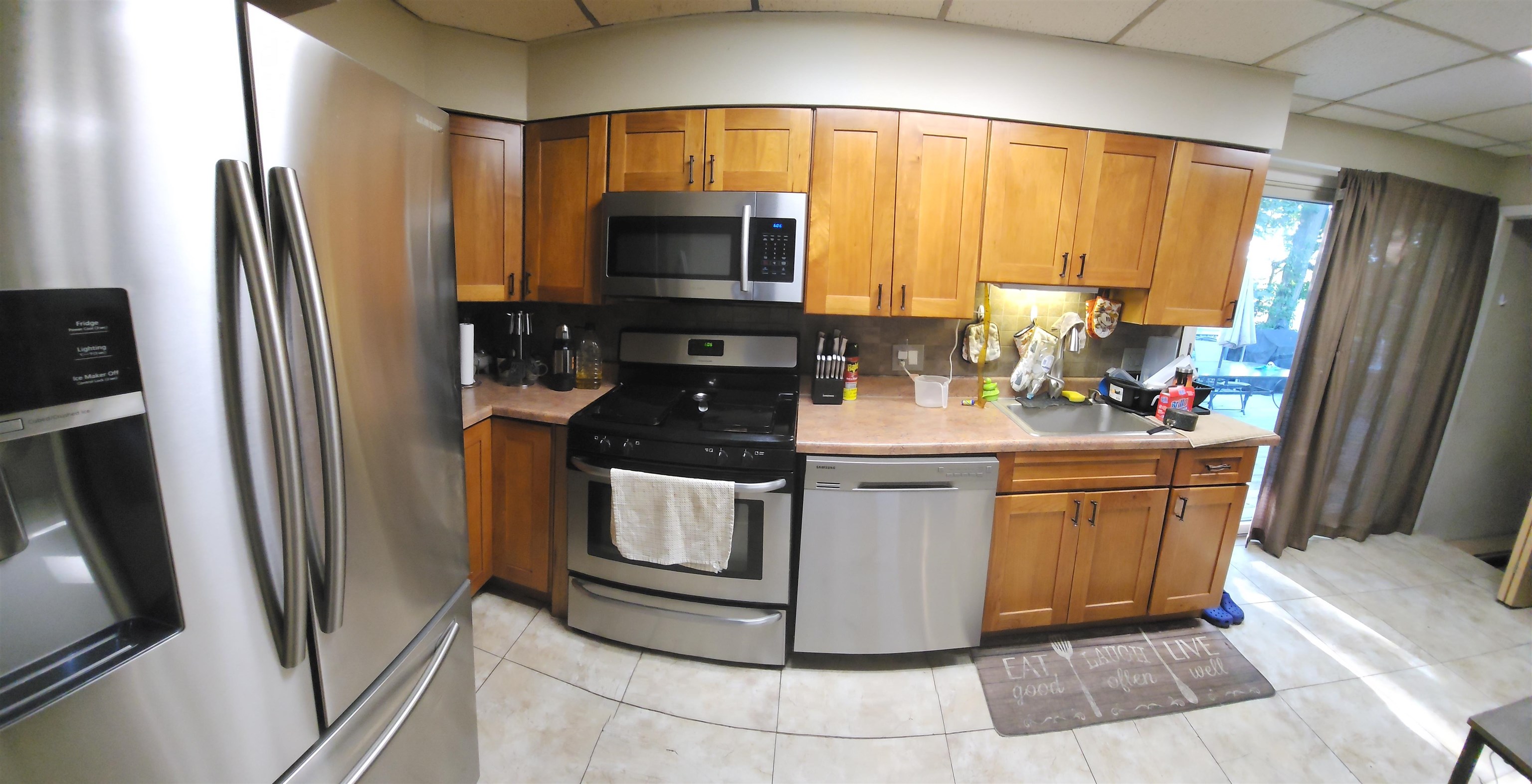 520 Stuyvesant Avenue Rutherford, NJ 07070 - Photo 3 of 9 a kitchen with stainless steel appliances a refrigerator sink and microwave